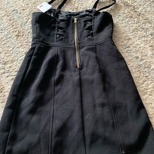 Women’s dress. Black. Back has holes and zipper.